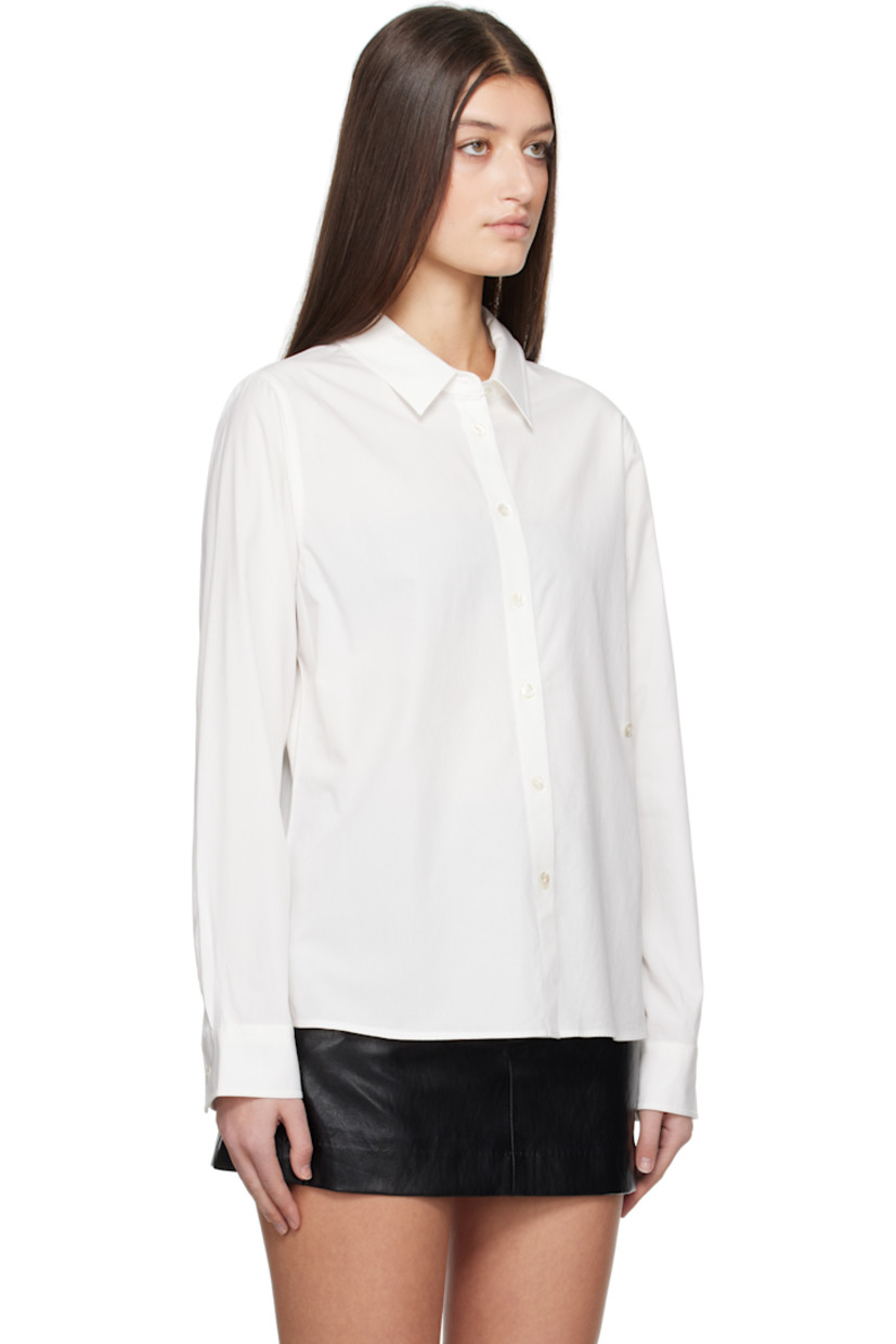 Rayon- and cotton-blend poplin shirt.

· Spread collar
· Button closure
· Button fastening at front for alternate styling
· Shirttail hem
· Pleated adjustable single-button barrel cuffs

Supplier color: White