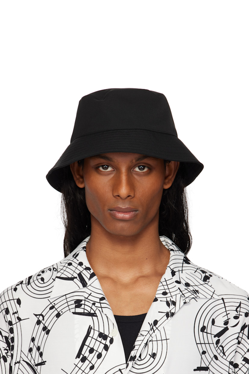 Wool twill bucket hat in black.

· Quilted brim
· Grosgrain browband at interior
· Satin twill lining

Part of the TAKAHIROMIYASHITA TheSoloist. x KIJIMA TAKAYUKI collaboration.

Supplier color: Black