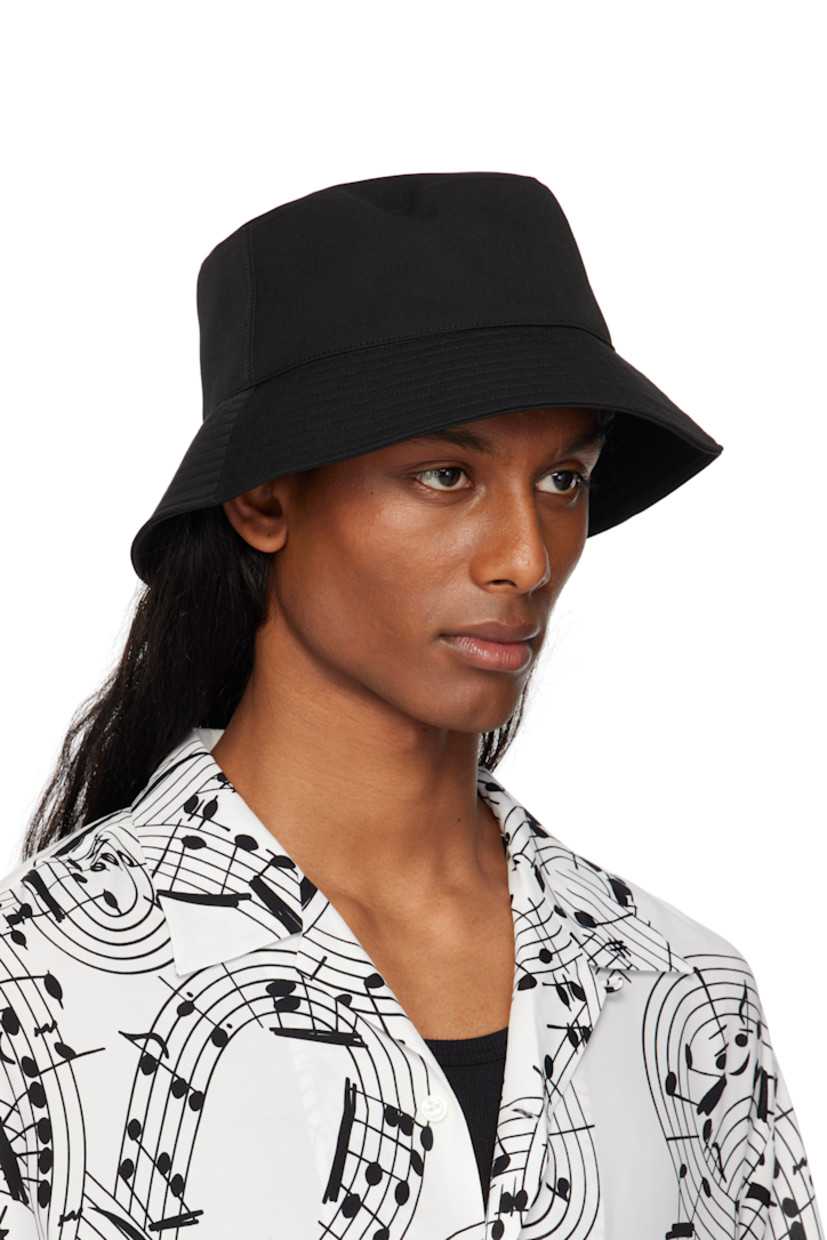 Wool twill bucket hat in black.

· Quilted brim
· Grosgrain browband at interior
· Satin twill lining

Part of the TAKAHIROMIYASHITA TheSoloist. x KIJIMA TAKAYUKI collaboration.

Supplier color: Black