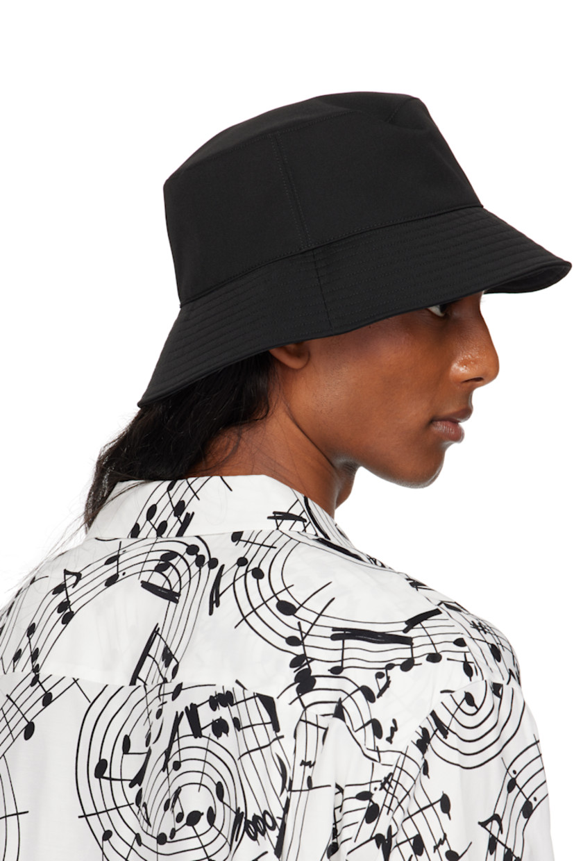 Wool twill bucket hat in black.

· Quilted brim
· Grosgrain browband at interior
· Satin twill lining

Part of the TAKAHIROMIYASHITA TheSoloist. x KIJIMA TAKAYUKI collaboration.

Supplier color: Black