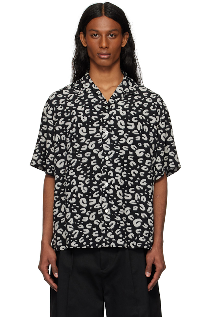 Plain-woven rayon shirt. Leopard pattern printed throughout. 

· Open spread collar
· Button closure 
· Patch pocket at chest
· Dropped shoulders
· Twin pleats at back yoke

Supplier color: Black/White