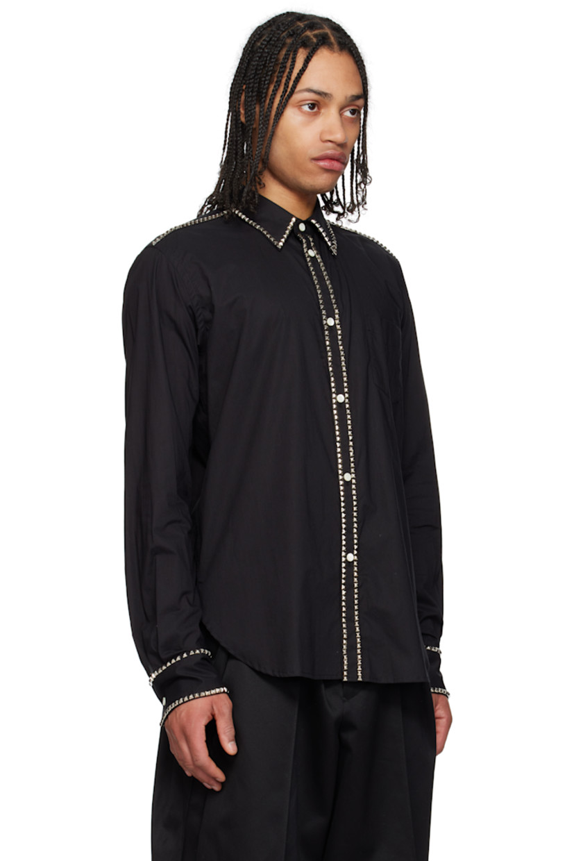 Cotton poplin shirt. Studded detailing throughout. 

· Spread collar
· Button closure
· Patch pocket 
· Shirttail hem
· Single-button barrel cuffs
· Box pleat at back yoke
· Logo-engraved mother-of-pearl hardware

Supplier color: Black