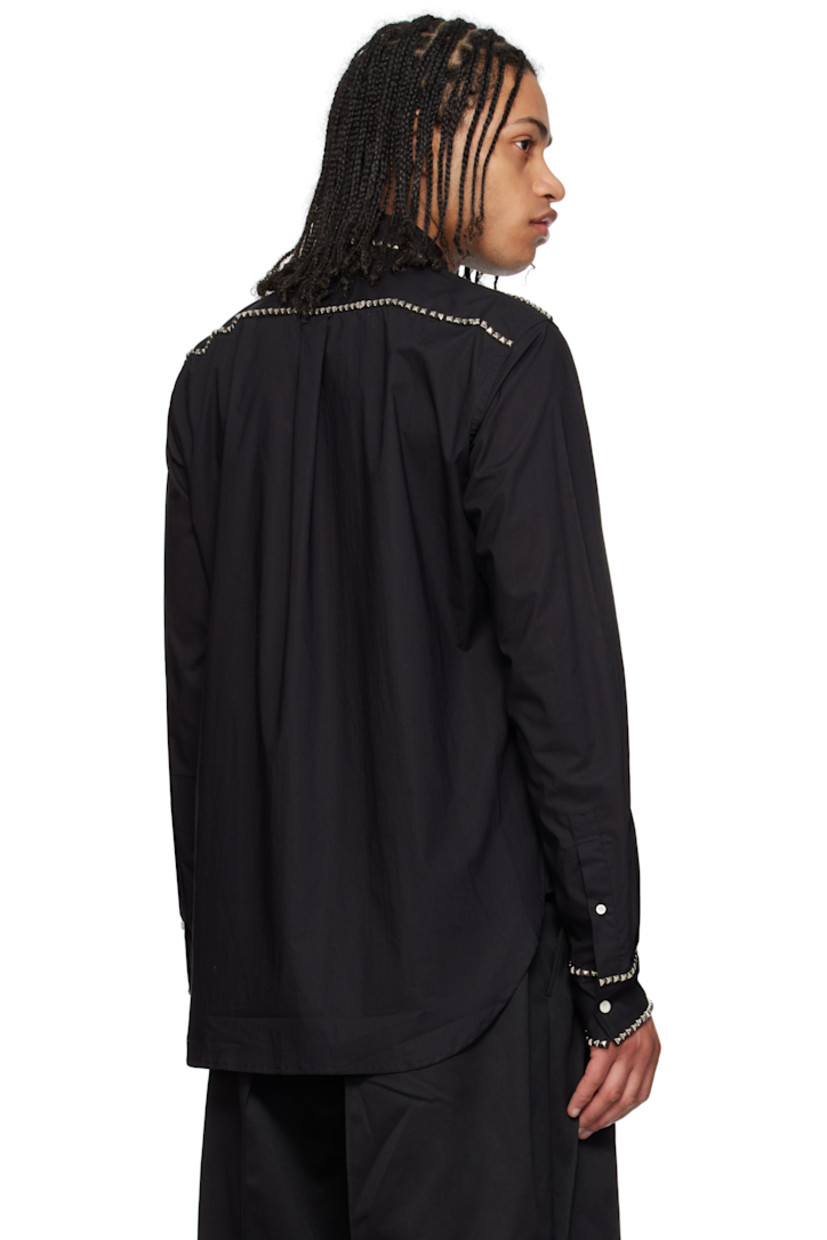 Cotton poplin shirt. Studded detailing throughout. 

· Spread collar
· Button closure
· Patch pocket 
· Shirttail hem
· Single-button barrel cuffs
· Box pleat at back yoke
· Logo-engraved mother-of-pearl hardware

Supplier color: Black