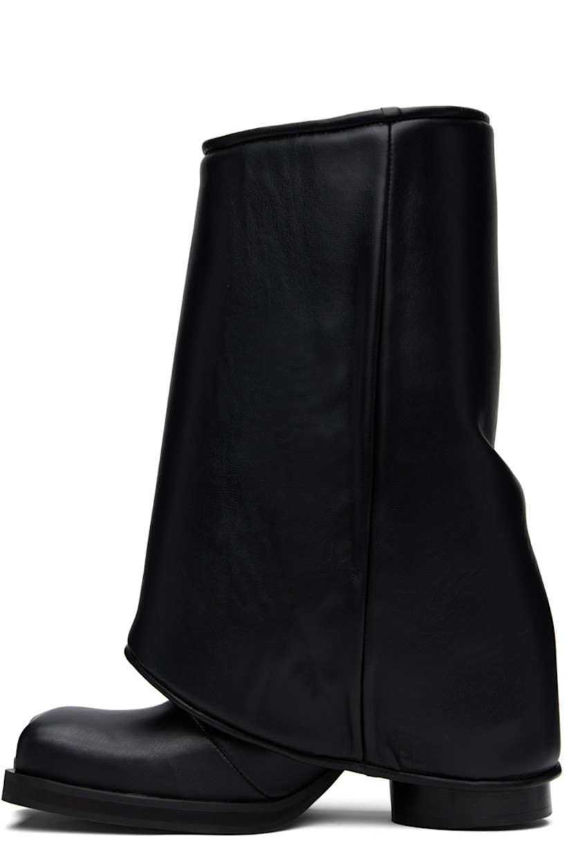 Calf-high buffed faux-leather boots in black.

· Modified square toe
· Detachable padded press-stud gaiters
· Elasticized gusset at sides
· Stacked cylindrical block heel
· Textured rubber sole
· Logo-engraved silver-tone hardware
· Heel: H3"

Supplier color: Black