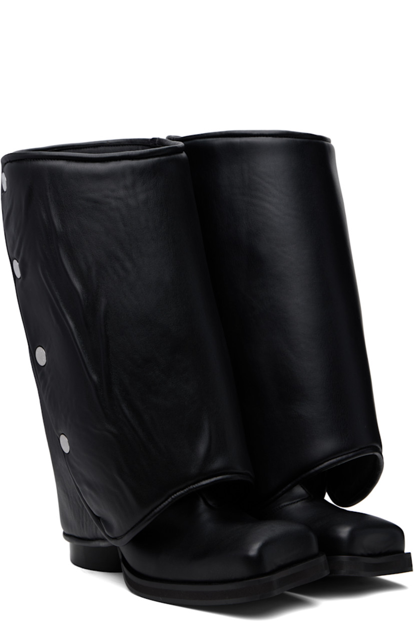 Calf-high buffed faux-leather boots in black.

· Modified square toe
· Detachable padded press-stud gaiters
· Elasticized gusset at sides
· Stacked cylindrical block heel
· Textured rubber sole
· Logo-engraved silver-tone hardware
· Heel: H3"

Supplier color: Black