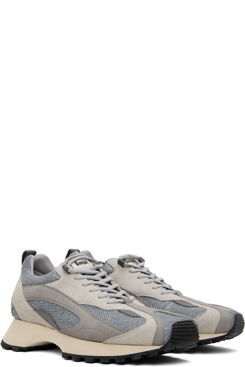 Low-top mesh and faux-suede sneakers in gray.

· Square toe
· Lace-up closure
· Logo patch at padded tongue
· Padded collar
· Pull-loop with logo hardware at heel collar
· Foam rubber midsole
· Treaded rubber sole

Supplier color: Grey/Silver
