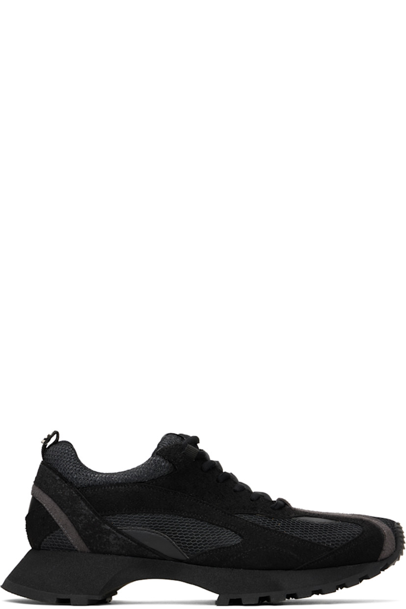 Low-top mesh and faux-suede sneakers in black.

· Square toe
· Lace-up closure
· Logo patch at padded tongue
· Padded collar
· Pull-loop with logo hardware at heel tab
· Mesh lining
· Foam rubber midsole
· Treaded rubber sole

Supplier color: Black