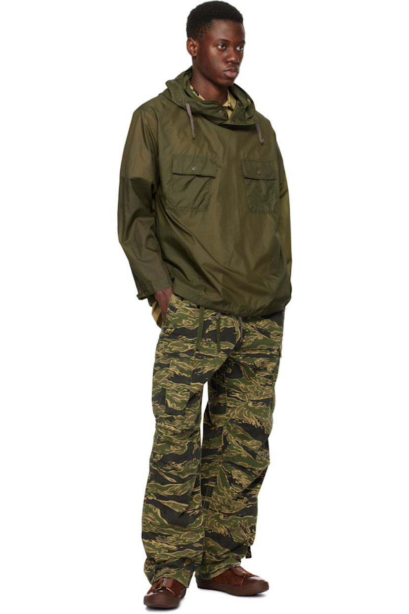 280 gsm cotton- and hemp-blend twill cargo pants. Camouflage pattern printed throughout.

· Loose-fit and tapered
· Offset drawstring at elasticized waistband
· Four-pocket styling
· Offset mock fly
· Darts at knees
· Bungee-style drawstring at cuffs
· Cargo pocket with straps at outseams

Supplier color: Mint gold