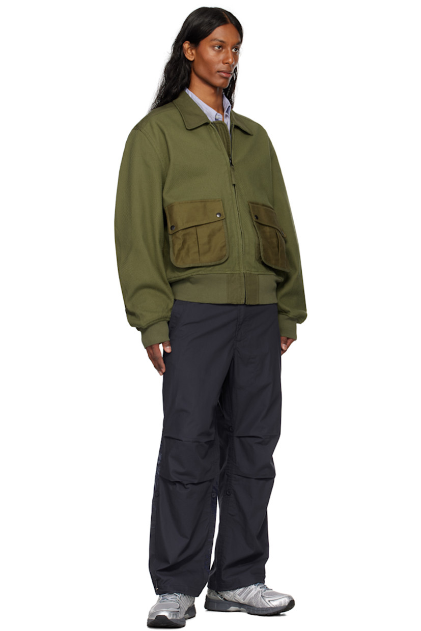 Lightweight 170 gsm organic cotton poplin trousers. 

· Loose-fit
· Snocord® bungee-style drawstring at waistband and cuffs
· Four-pocket styling
· Zip fly
· Tucks at knees
· Snobutton® fastenings at legs for cropped styling
· Embroidered eyelets at back pocket
· Graphic embroidered at back leg
· Logo-engraved black and navy hardware

Supplier color: Navy