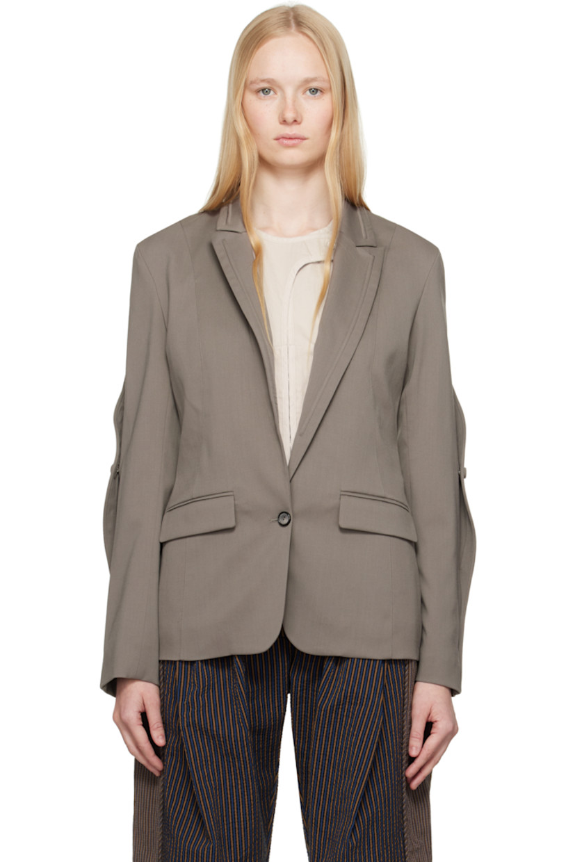 Stretch virgin wool twill blazer.

· Piping at peaked lapel and sleeves
· Button closure
· Flap pockets
· Buttoned expansion panel at sleeves
· Central vent at back hem
· Welt pockets at interior
· Full viscose satin lining

Supplier color: Slate grey