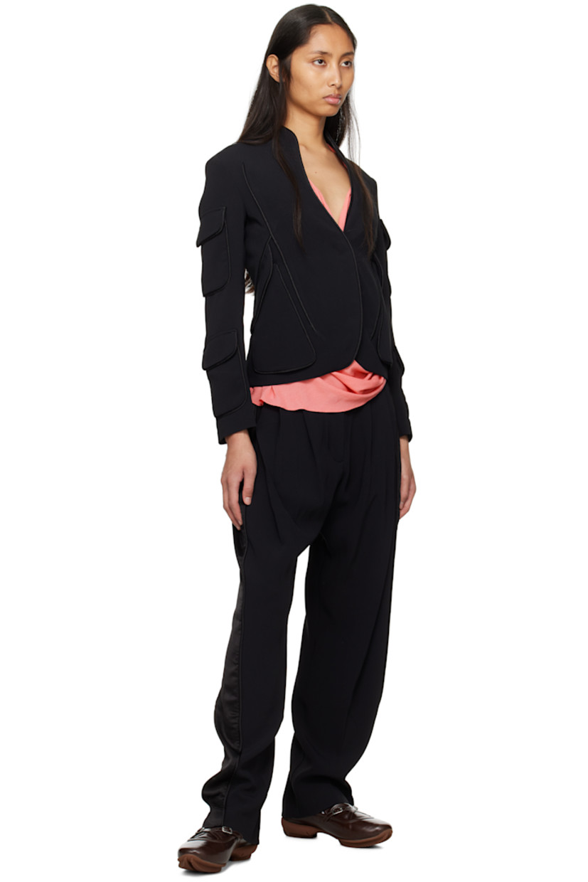Stretch viscose crepe blazer. Satin piping throughout. 

· Stand collar
· Hook-eye closure
· Flap pockets at front and at sleeves
· Central vent at back hem
· Full satin lining
· Welt pockets at interior

Supplier color: Space black/Glossy black