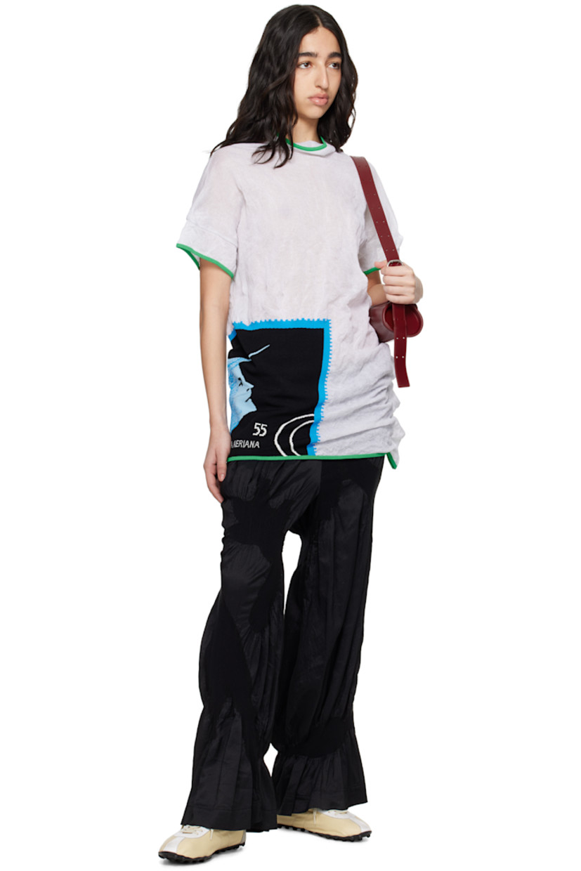 Semi-sheer and crinkled knit cotton-blend T-shirt. Metallic thread detailing throughout.

· Asymmetrical construction
· Rib-knit trim at mock neck, hem, and cuffs
· Intarsia graphic at front
· Dropped shoulder
· Cap sleeves

Supplier color: Star white/Night scape intarsia