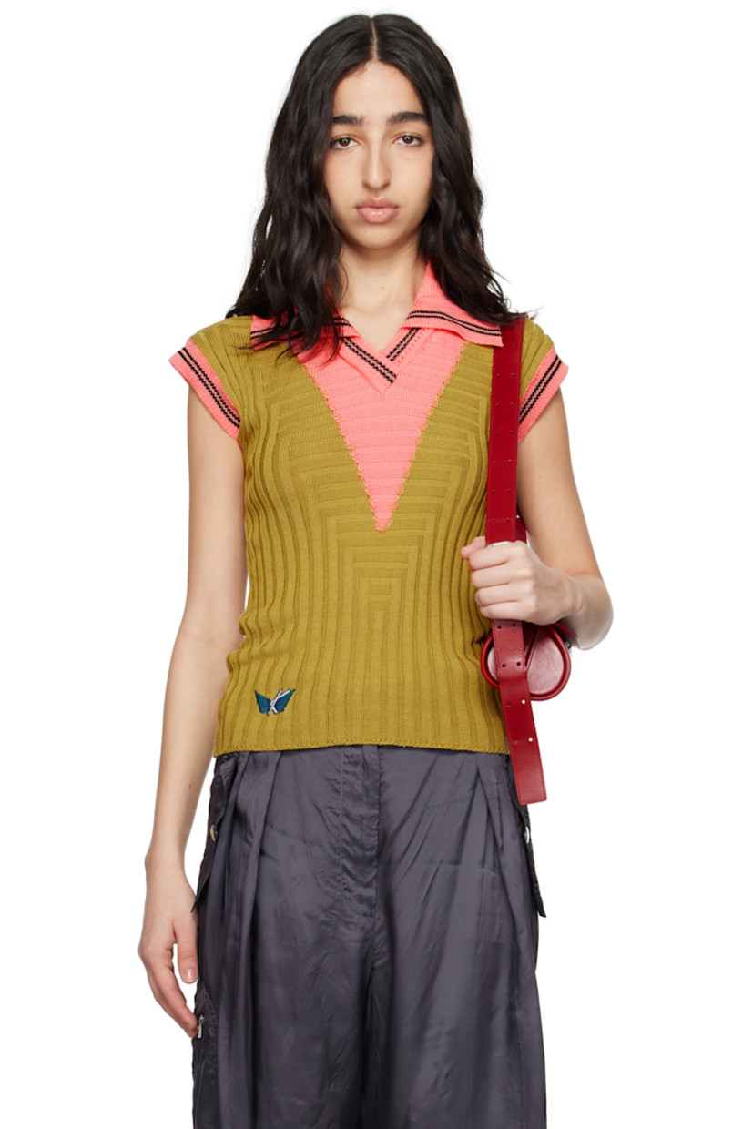 Rib-knit mercerized cotton polo.

· Slim-fit
· Striped spread collar, open placket, and cuffs
· Intarsia panel at front and back
· Logo graphic embroidered at front hem
· Cap sleeves

Supplier color: Ochre/Coral pink