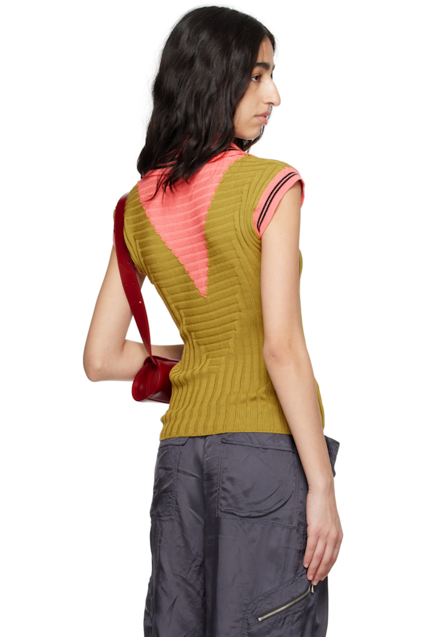 Rib-knit mercerized cotton polo.

· Slim-fit
· Striped spread collar, open placket, and cuffs
· Intarsia panel at front and back
· Logo graphic embroidered at front hem
· Cap sleeves

Supplier color: Ochre/Coral pink