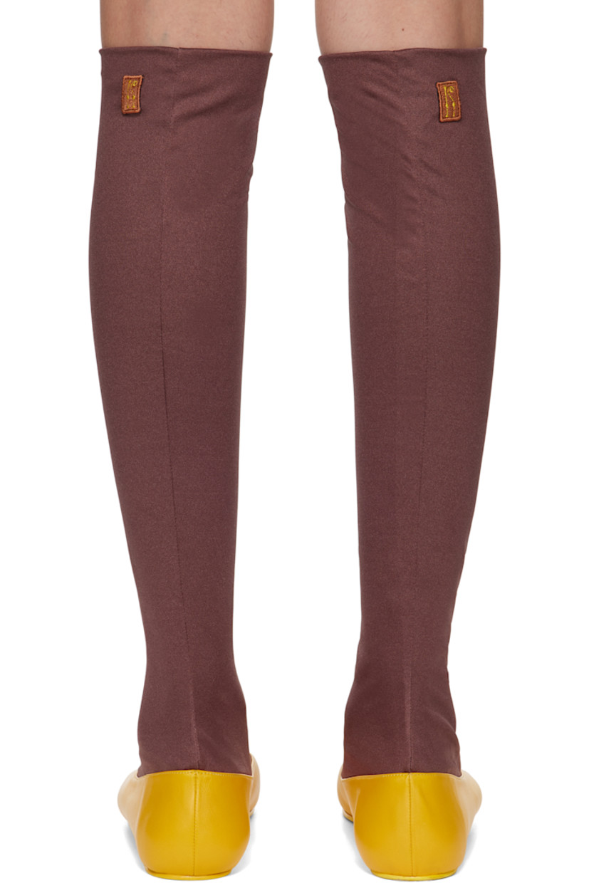 Buffed leather and double-cloth jersey ballerina flats in yellow and brown.

· Extended sock-style collar
· Embroidered logo patch at outer side
· Leather sole with rubber injection

Supplier color: Marigold/Chestnut