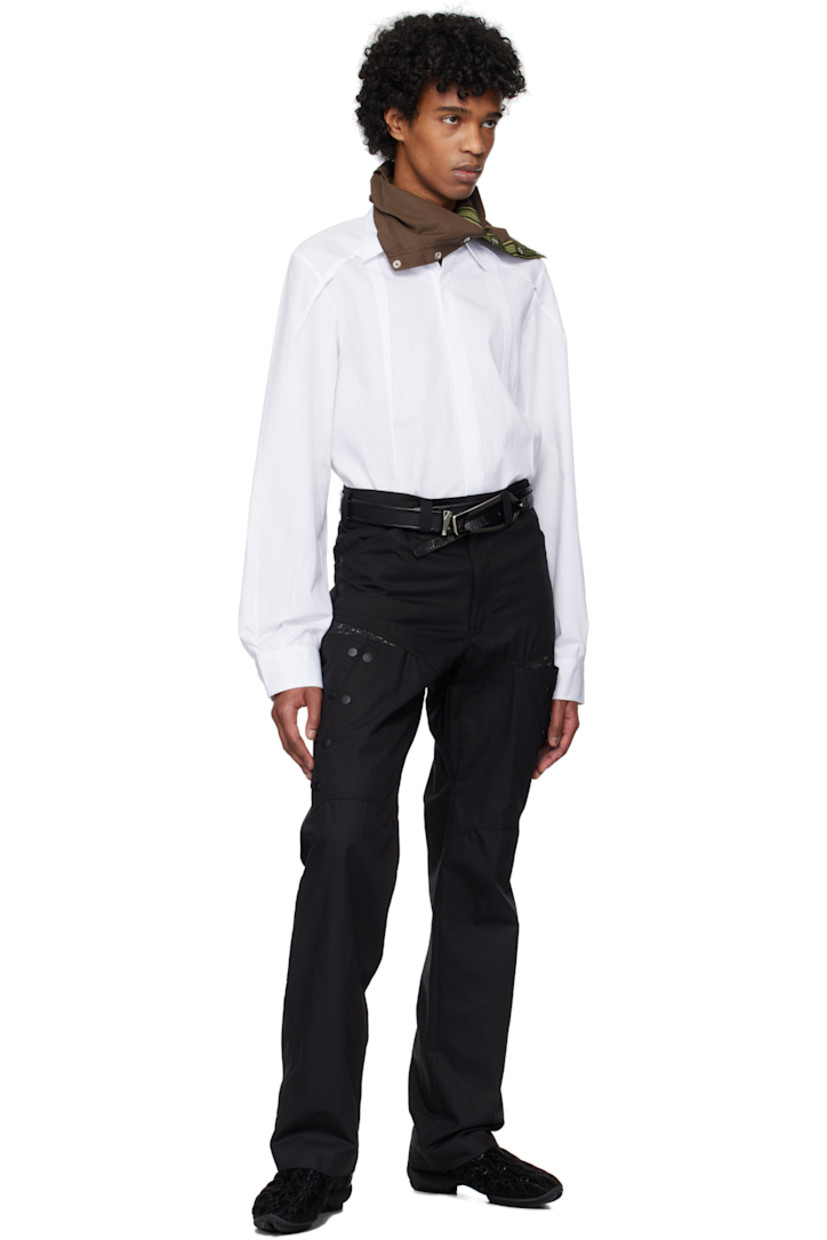 Cotton poplin shirt. Woven stripes and raw edges throughout.

· Paneled construction
· Spread collar
·� Button closure
· Shirttail hem
· Concealed buttoned barrel cuffs
· Twin pleats at back

Supplier color: White stripes