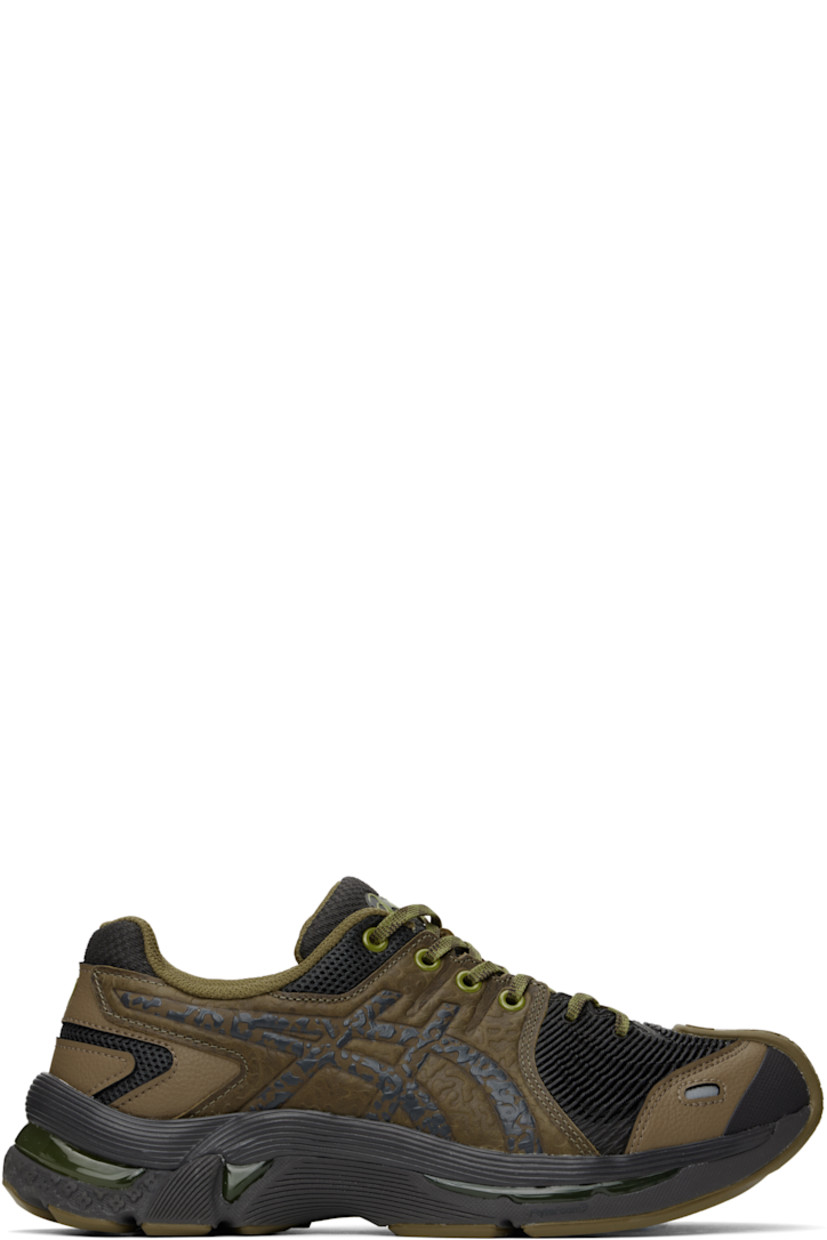 Low-top grained leather, mesh, and rubber sneakers in brown and black.

· Graphic pattern embossed throughout
· Logo embossed at toe and heel tab
· Lace-up closure
· Logo bonded at padded tongue
· Padded collar
· Signature stripes embossed at sides
· Mesh lining
· FLYTEFOAM™ PROPEL foam rubber midsole
· AHAR+ treaded rubber sole with GEL™ technology

Part of the Kiko Kostadinov x Asics collaboration.

Supplier color: Bronze/Brown