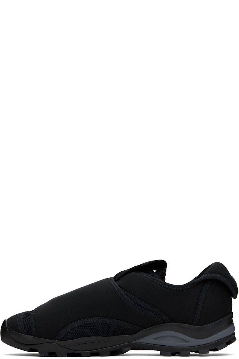 Low-top neoprene and mesh sneakers in black.

· Velcro strap at vamp
· Concealed bungee-style drawstring closure
· Woven pull-loop at padded tongue
· Logo hardware at outer side and heel collar
· Pull-tab at heel collar
· Neoprene and suede lining
· Treaded Vibram® rubber sole

Supplier color: Black matt