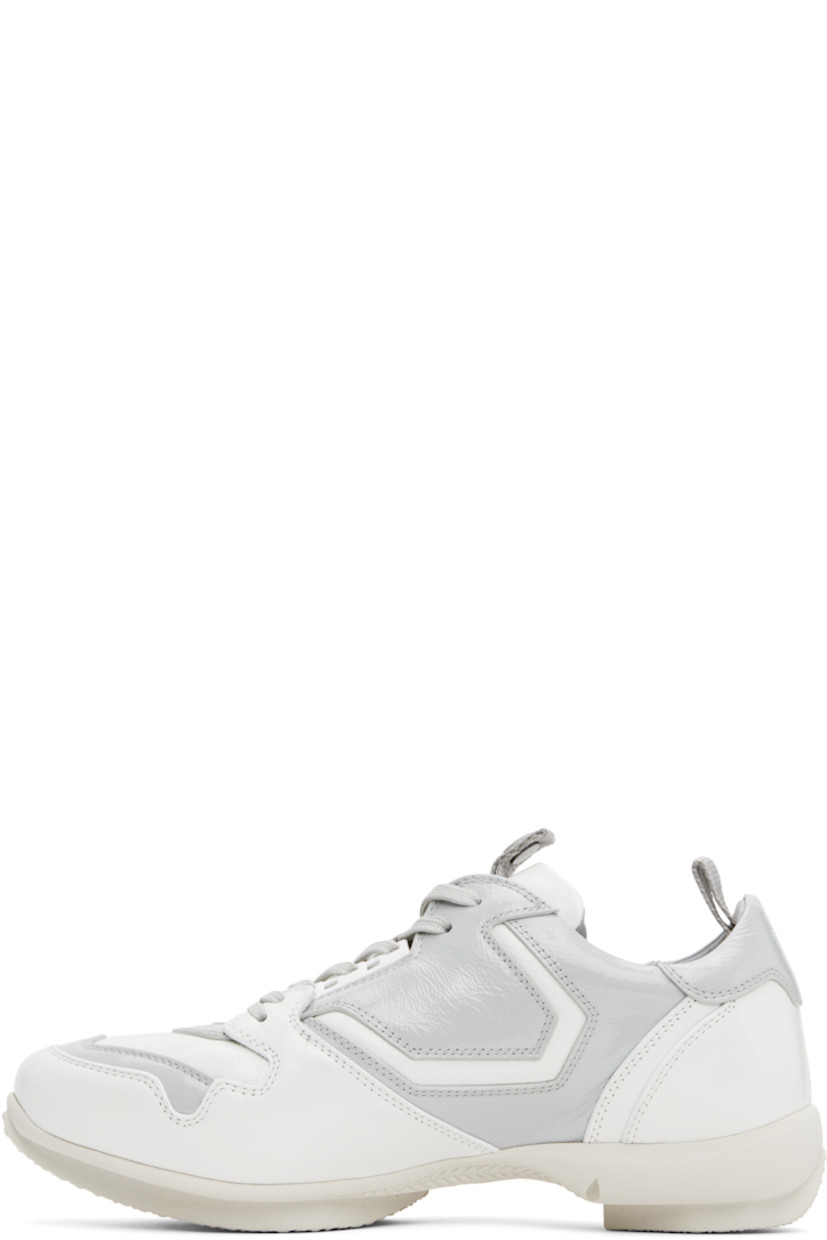 Low-top polished leather and patent calfskin sneakers in white and gray.

· Lace-up closure
· Pull-loop with logo hardware at padded tongue 
· Padded collar
· Pull-loop at heel collar
· Buffed leather and suede lining
· Treaded rubber sole

Supplier color: White brilliant