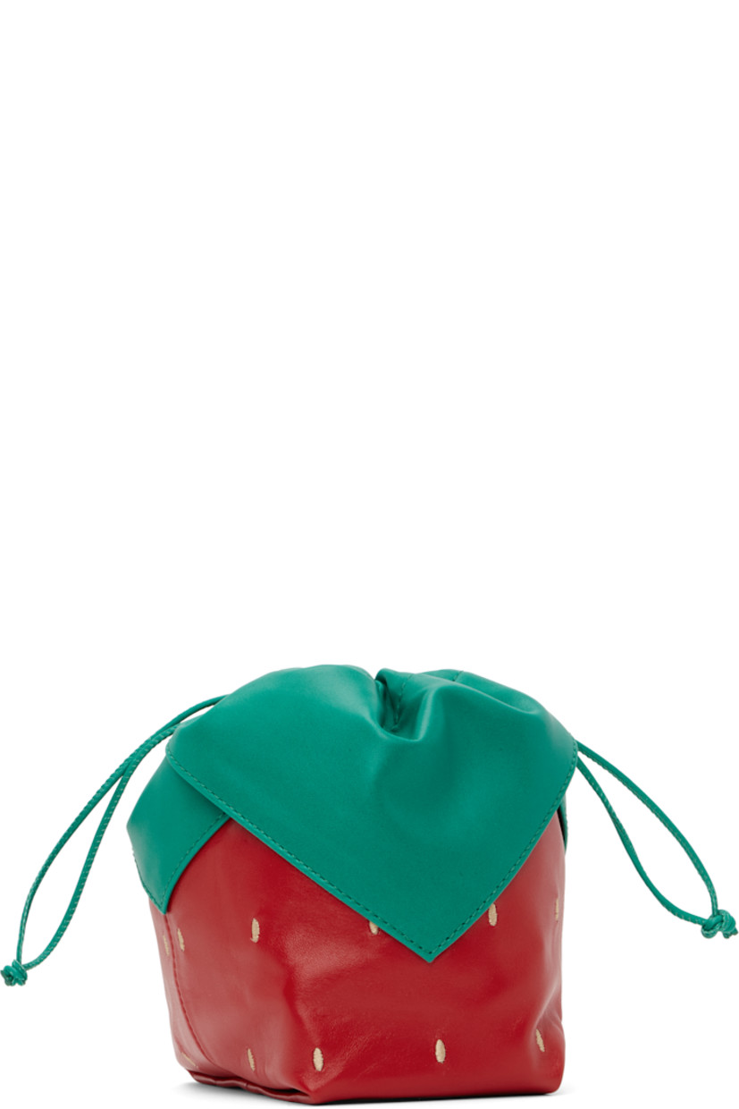 Handcrafted buffed lambskin pouch in green and red. 

· Paneled construction 
· Drawstring closure at throat 
· Organic cotton canvas lining 
· H7" x W6.5" x D5"

Supplier color: Red