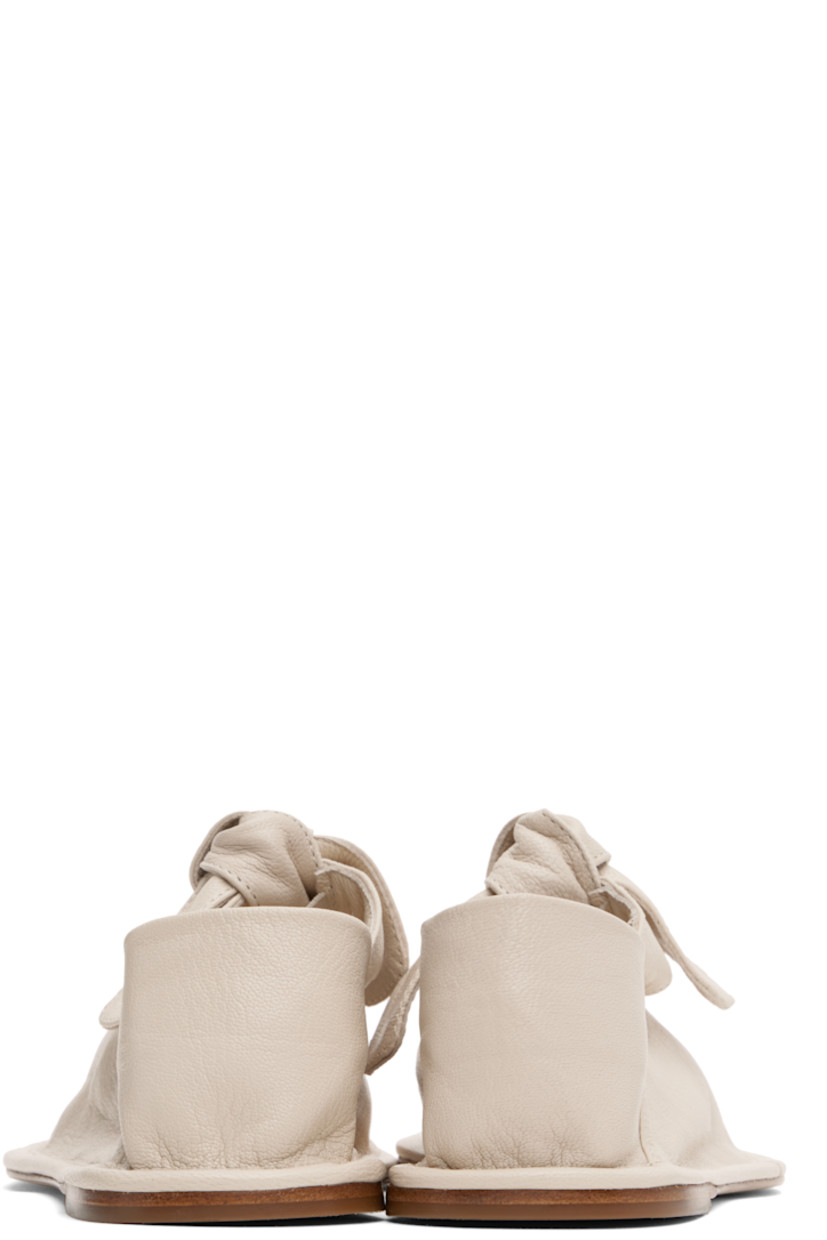 Handcrafted grained lambskin Mary Jane-style ballerina flats in off-white.

· Square toe
· Self-tie bow accent at vamp 
· Collapsible heel counter
· Calfskin sole with rubber injection

Supplier color: Cream