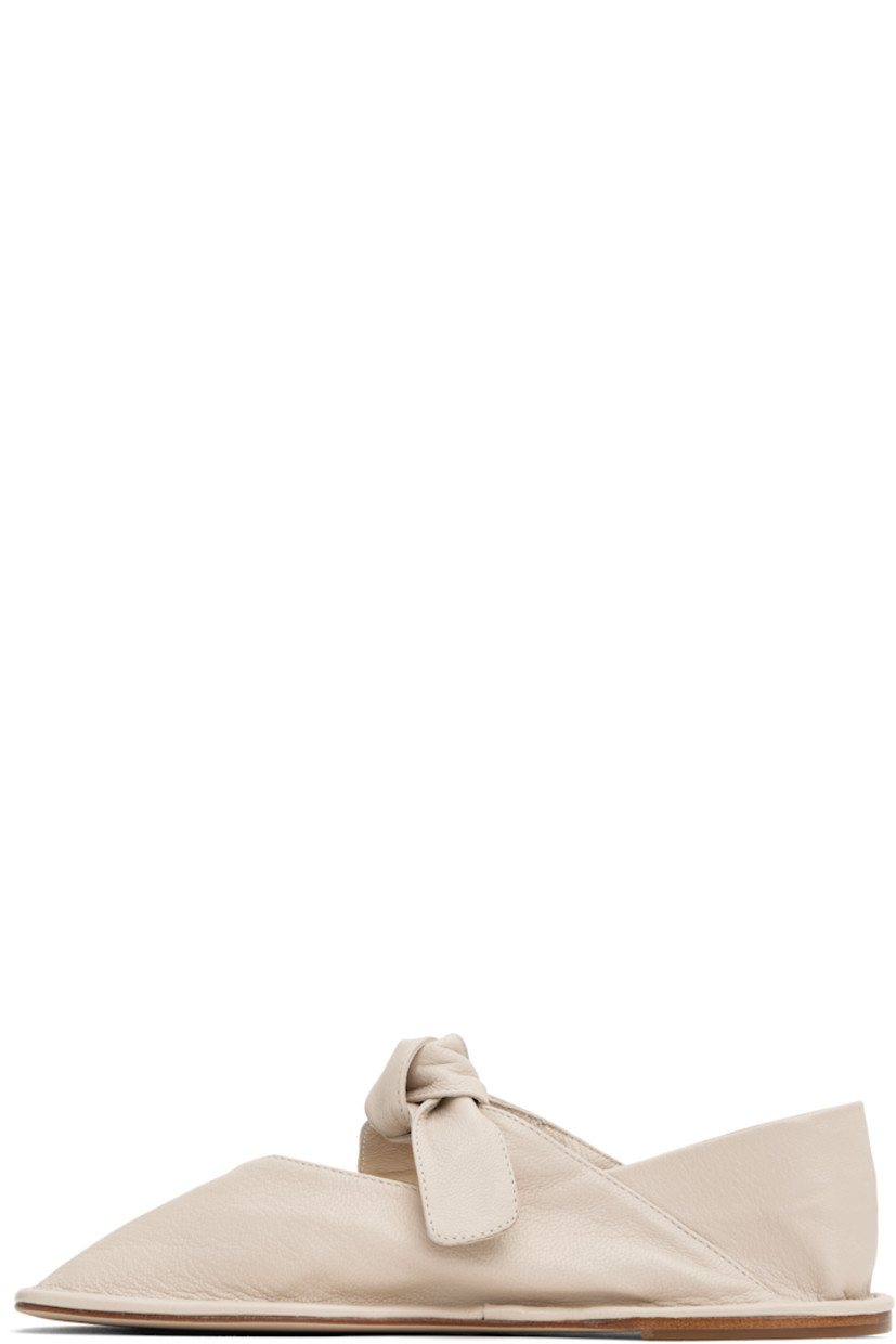 Handcrafted grained lambskin Mary Jane-style ballerina flats in off-white.

· Square toe
· Self-tie bow accent at vamp 
· Collapsible heel counter
· Calfskin sole with rubber injection

Supplier color: Cream