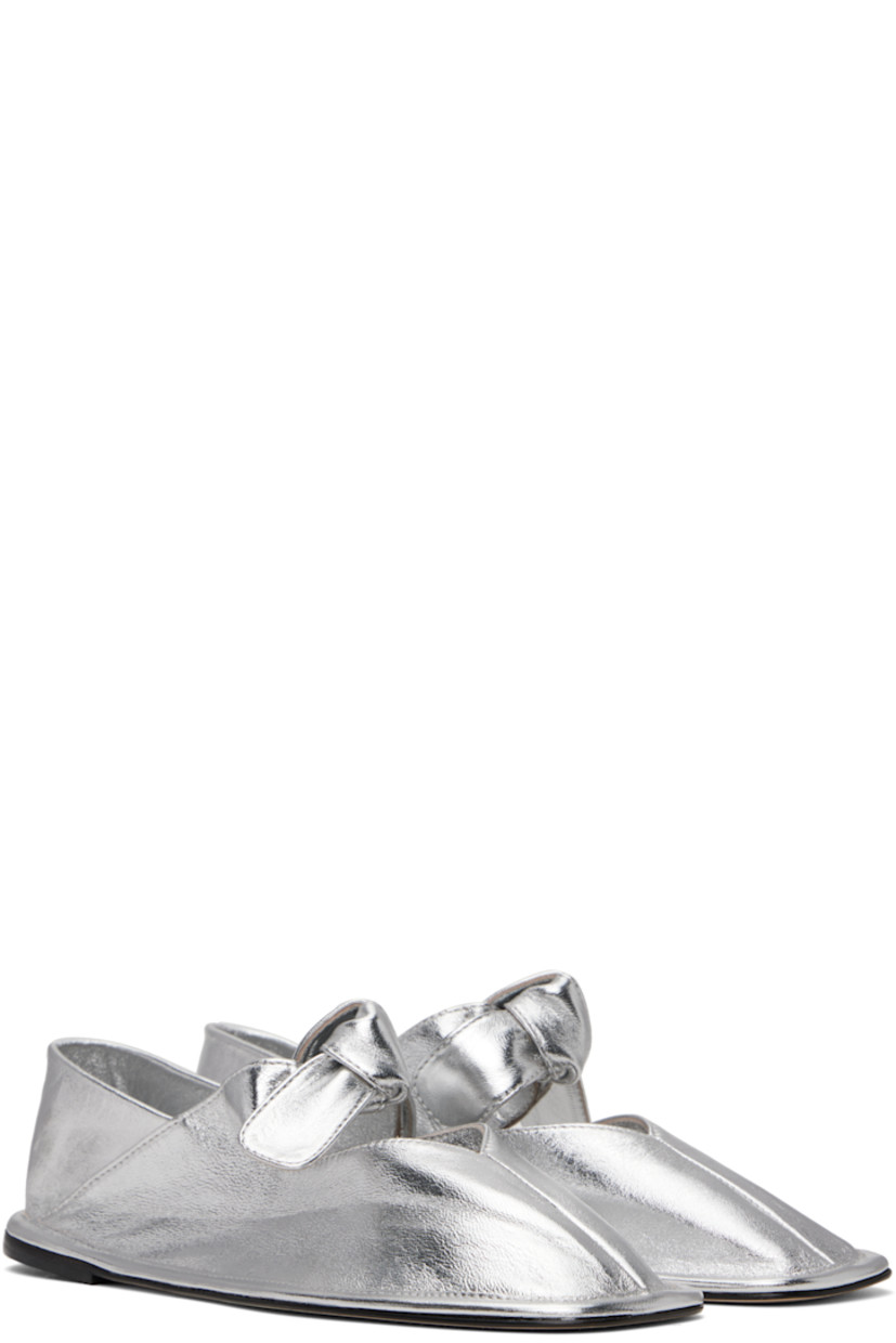Handcrafted grained lambskin ballerina flats in metallic silver tone.

· Square toe
· Knotted detailing at partially elasticized strap
· Collapsible heel counter
· Calfskin nubuck sole with rubber injection

Supplier color: Light silver