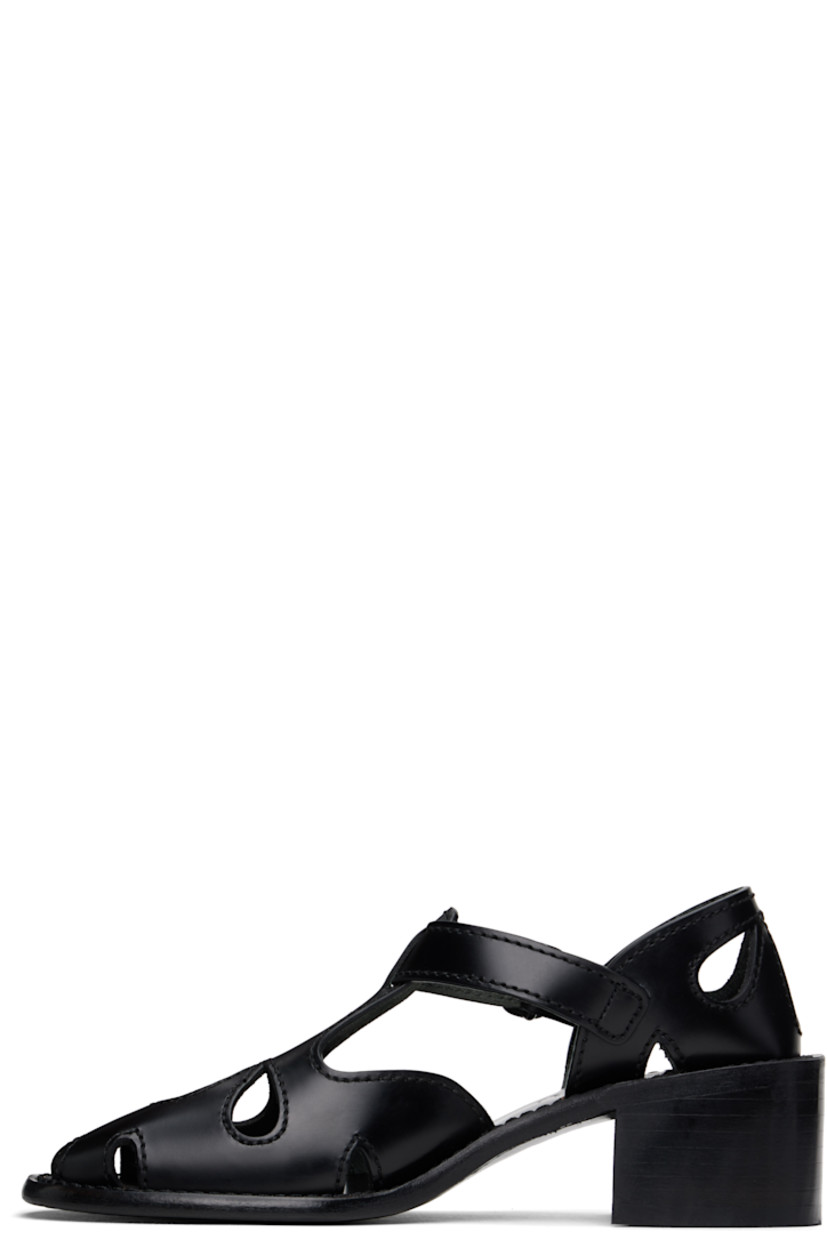 Handcrafted polished calfskin heels in black.

· Cutouts and embroidered detailing throughout
· Pin-buckle ankle strap
· Logo embossed at calfskin footbed
· Stacked calfskin block heel and midsole
· Calfskin sole with rubber injection
· Heel: H2"

Supplier color: Black