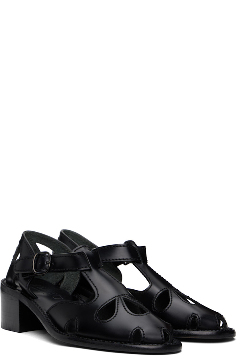 Handcrafted polished calfskin heels in black.

· Cutouts and embroidered detailing throughout
· Pin-buckle ankle strap
· Logo embossed at calfskin footbed
· Stacked calfskin block heel and midsole
· Calfskin sole with rubber injection
· Heel: H2"

Supplier color: Black