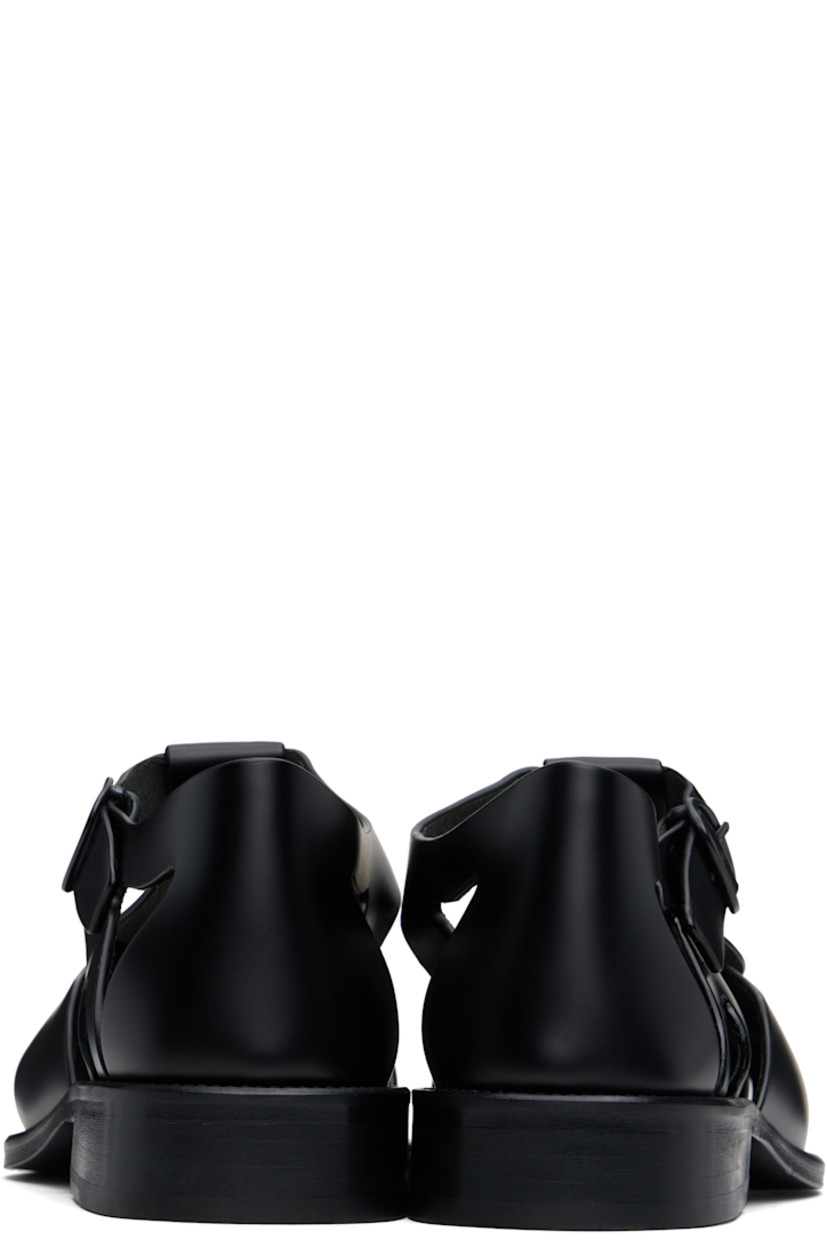 Handcrafted polished calfskin flat sandals in black.

· Cutouts throughout
· Pin-buckle ankle strap
· Logo embossed at padded calfskin footbed
· Suede lining
· Serrated detailing at welt
· Stacked calfskin heel and midsole
· Calfskin sole with rubber injection

Supplier color: Black