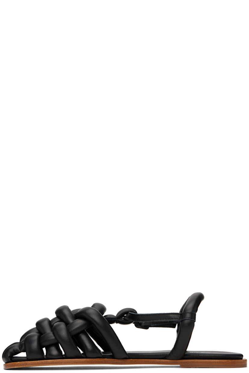 Handcrafted grained lambskin flat sandals in black.

· Square toe
· Woven straps at vamp
· Pin-buckle ankle strap
· Fixed slingback strap
· Logo embossed at padded lambskin footbed
· Nubuck sole with rubber injection

Supplier color: Black