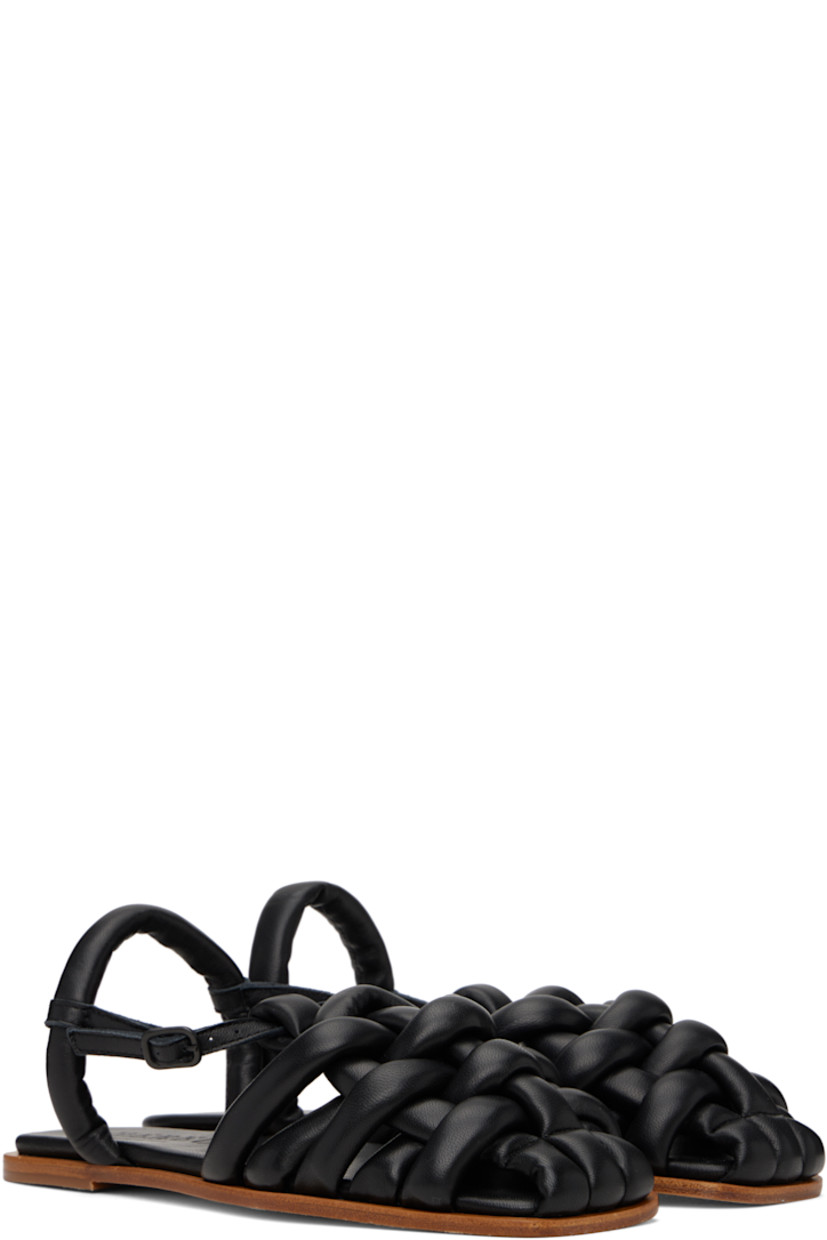Handcrafted grained lambskin flat sandals in black.

· Square toe
· Woven straps at vamp
· Pin-buckle ankle strap
· Fixed slingback strap
· Logo embossed at padded lambskin footbed
· Nubuck sole with rubber injection

Supplier color: Black