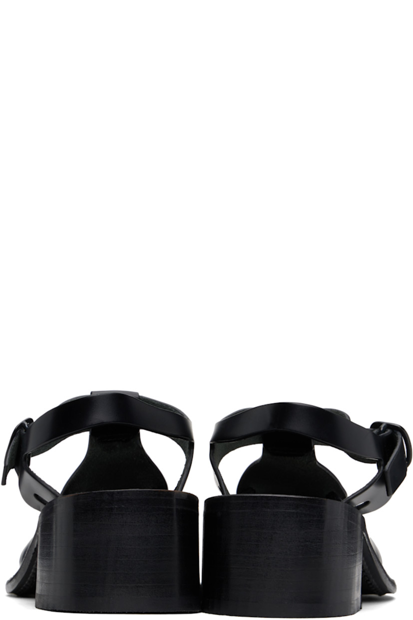 Handcrafted polished calfskin heels in black.

· Cutouts throughout
· Pin-buckle ankle strap
· Logo embossed at calfskin footbed
· Suede lining
· Serrated detailing at welt
· Stacked calfskin heel and midsole
· Calfskin sole with rubber injection
· Heel: H2"

Supplier color: Black