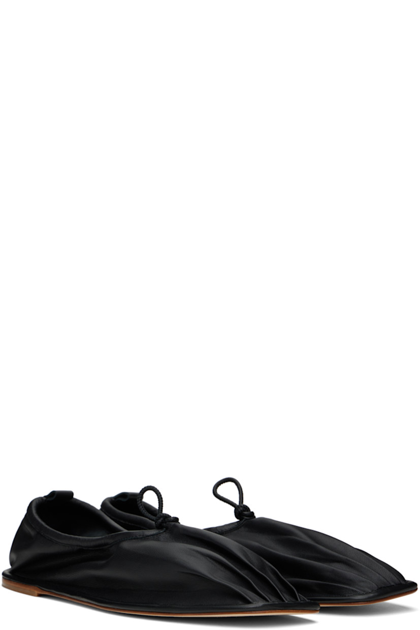 Handcrafted buffed lambskin loafers in black.

· Pleats at square toe
· Drawstring at collar
· Pull-loop at heel collar
· Suede interior
· Leather sole with rubber injection

Supplier color: Black