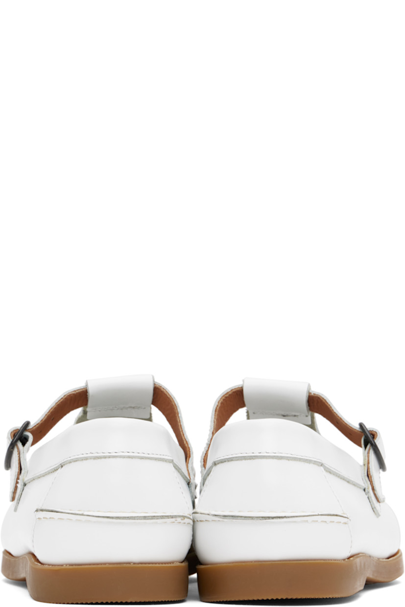 Handcrafted polished calfskin boat shoes in white.

· Moc toe
· Pin-buckle strap at vamp
· Pinched seam at heel counter
· Logo-embossed padded leather footbed
· Suede lining
· Treaded rubber sole 
· Contrast stitching in beige

Supplier color: White