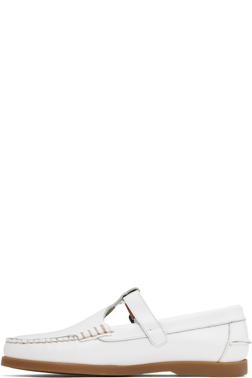 Handcrafted polished calfskin boat shoes in white.

· Moc toe
· Pin-buckle strap at vamp
· Pinched seam at heel counter
· Logo-embossed padded leather footbed
· Suede lining
· Treaded rubber sole 
· Contrast stitching in beige

Supplier color: White