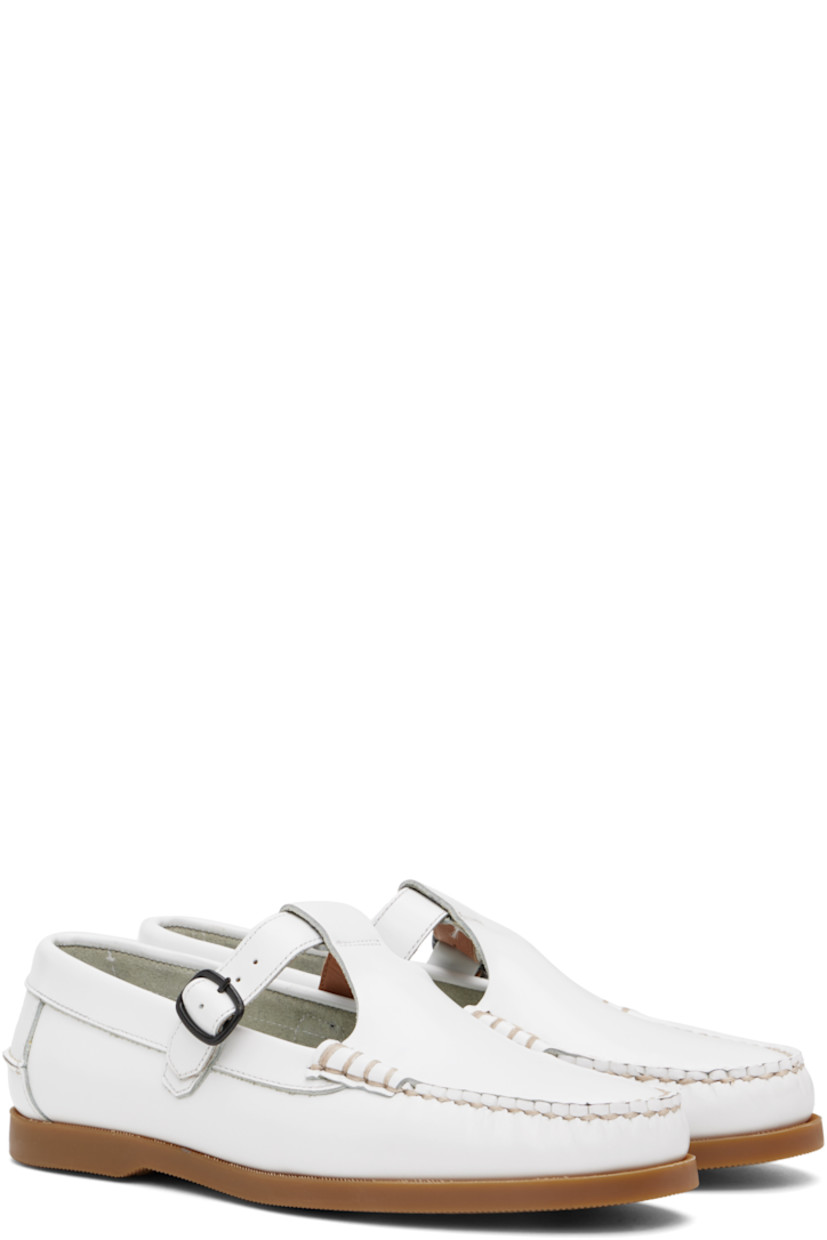 Handcrafted polished calfskin boat shoes in white.

· Moc toe
· Pin-buckle strap at vamp
· Pinched seam at heel counter
· Logo-embossed padded leather footbed
· Suede lining
· Treaded rubber sole 
· Contrast stitching in beige

Supplier color: White