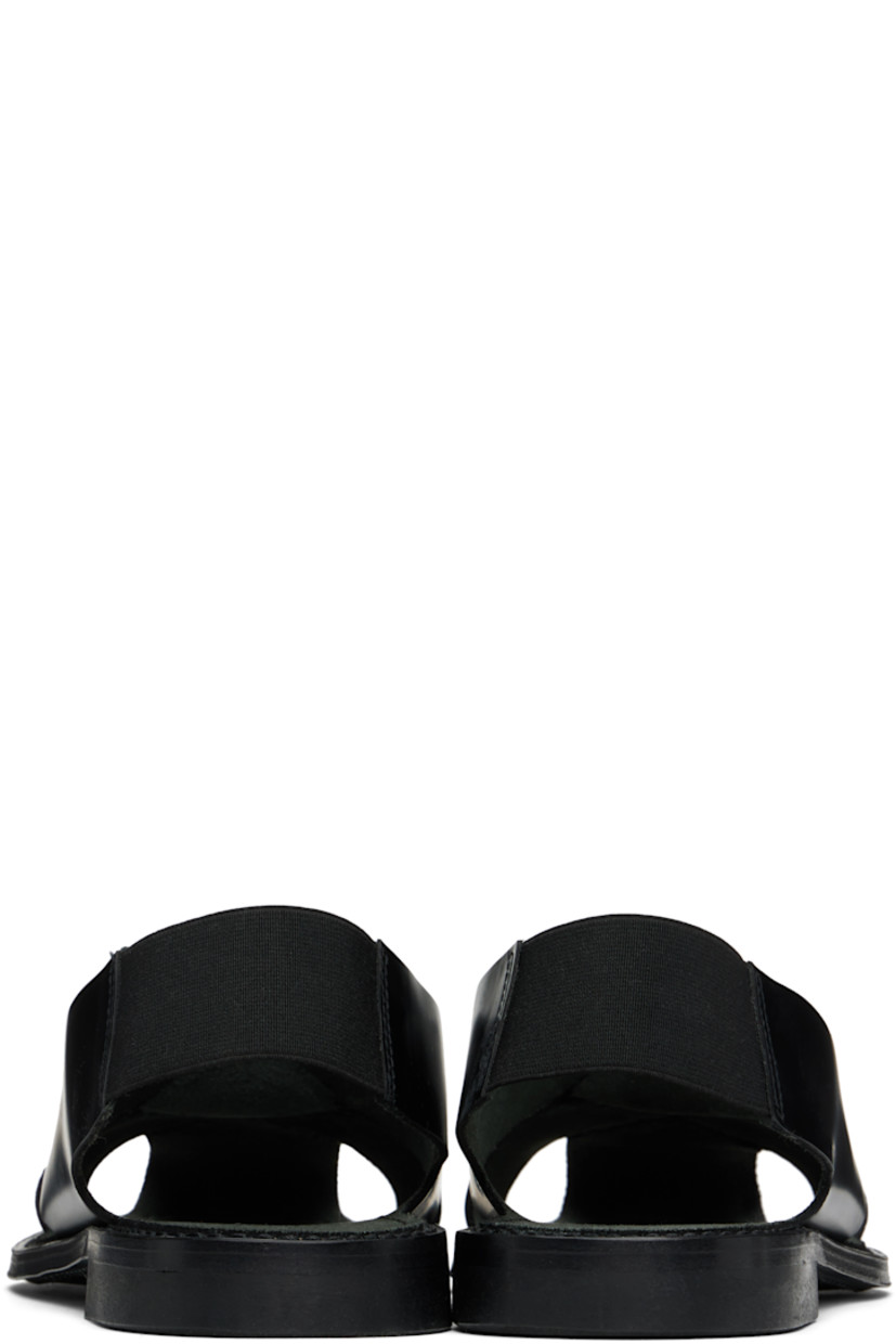 Hand-sewn polished calfskin sandals in black.

· Cutouts at toe and sides
· Square toe
· Elasticized slingback strap
· Suede lining
· Logo embossed at padded footbed
· Stacked leather heel with rubber injection
· Leather sole

Supplier color: Black