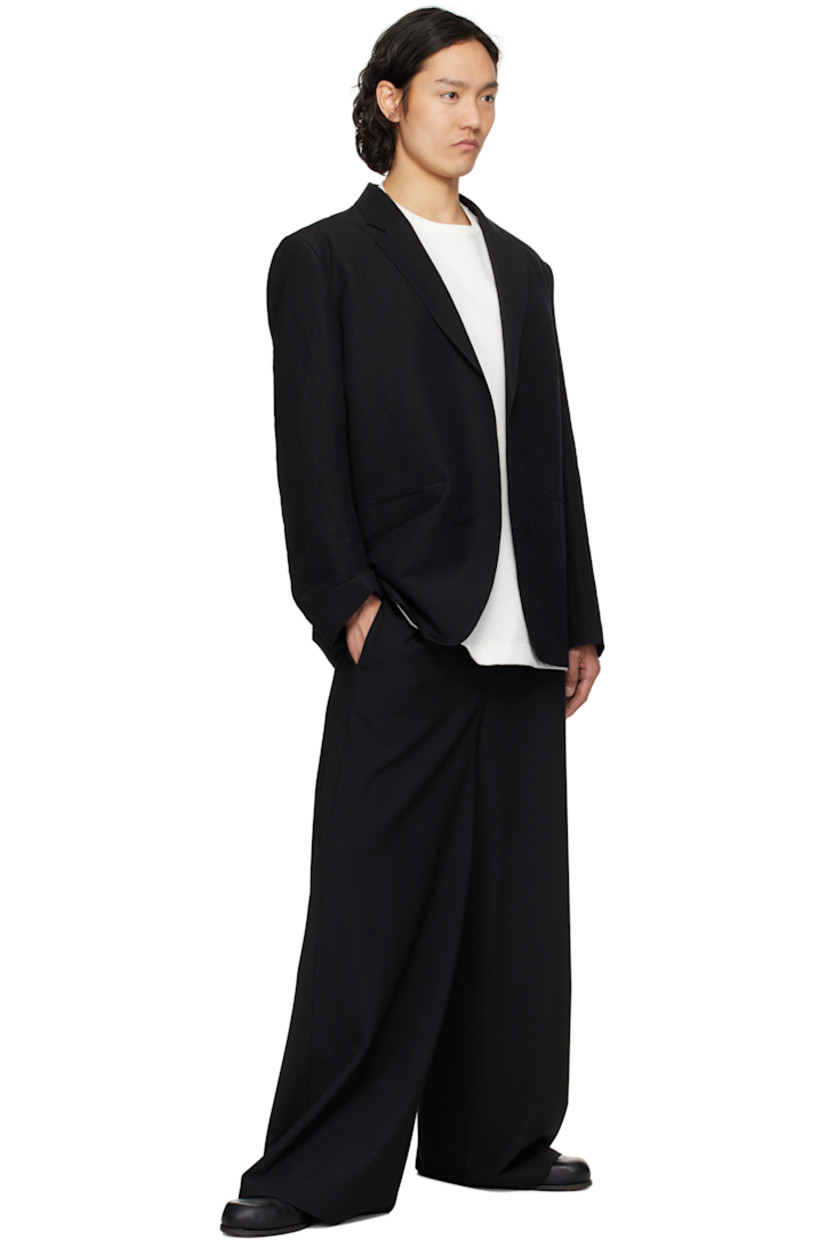 Wool- and linen-blend canvas blazer.

· Notched lapel
· Open front
· Welt pockets
· Padded shoulders
· Logo patch at cuff
· Welt pockets at interior
· Partial satin lining

Part of the N.HOOLYWOOD COMPILE collection.

Supplier color: Black