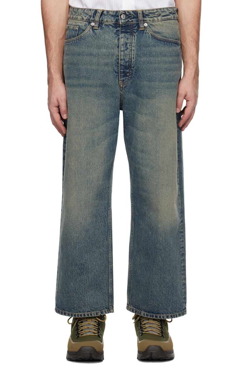 Wide-leg non-stretch regenerative- and organic cotton-blend denim jeans. Fading and whiskering throughout.

· Belt loops
· Five-pocket styling
· Button-fly
· Cropped legs
· Logo patch at back waistband
· Logo-engraved silver-tone hardware

Supplier color: Mid blue dirty