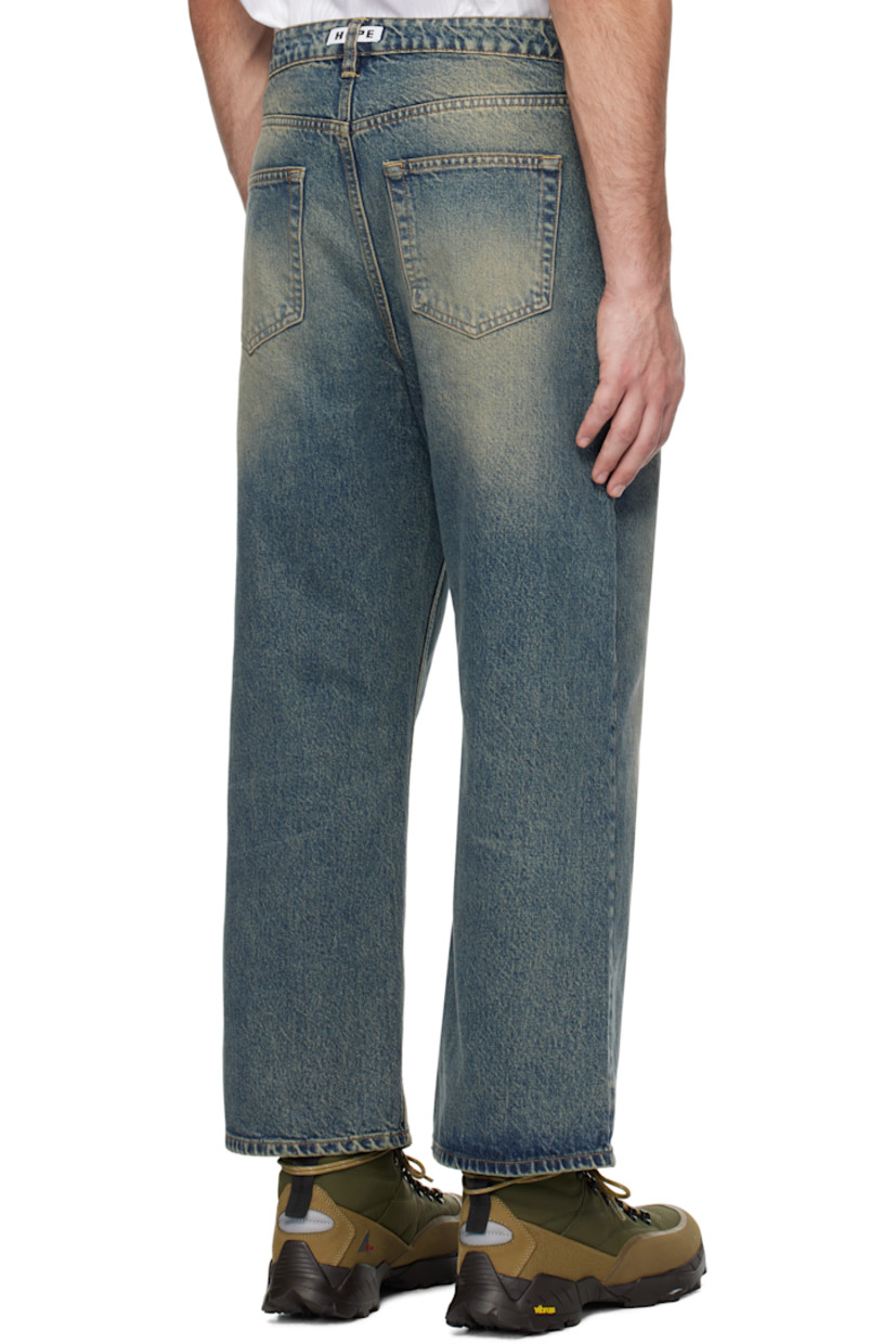 Wide-leg non-stretch regenerative- and organic cotton-blend denim jeans. Fading and whiskering throughout.

· Belt loops
· Five-pocket styling
· Button-fly
· Cropped legs
· Logo patch at back waistband
· Logo-engraved silver-tone hardware

Supplier color: Mid blue dirty