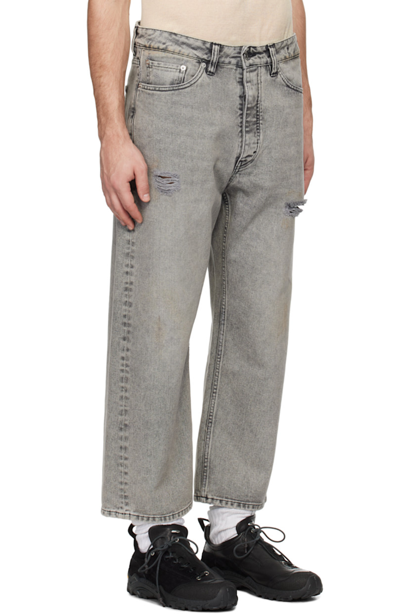 Non-stretch regenerative- and organic cotton-blend denim jeans. Fading and distressing throughout.

· Wide-leg
· Belt loops
· Five-pocket styling
· Button fly
· Dropped inseam
· Cropped legs
· Logo patch at back waistband
· Logo-engraved silver-tone hardware
· Contrast stitching in black

Supplier color: Grey vintage