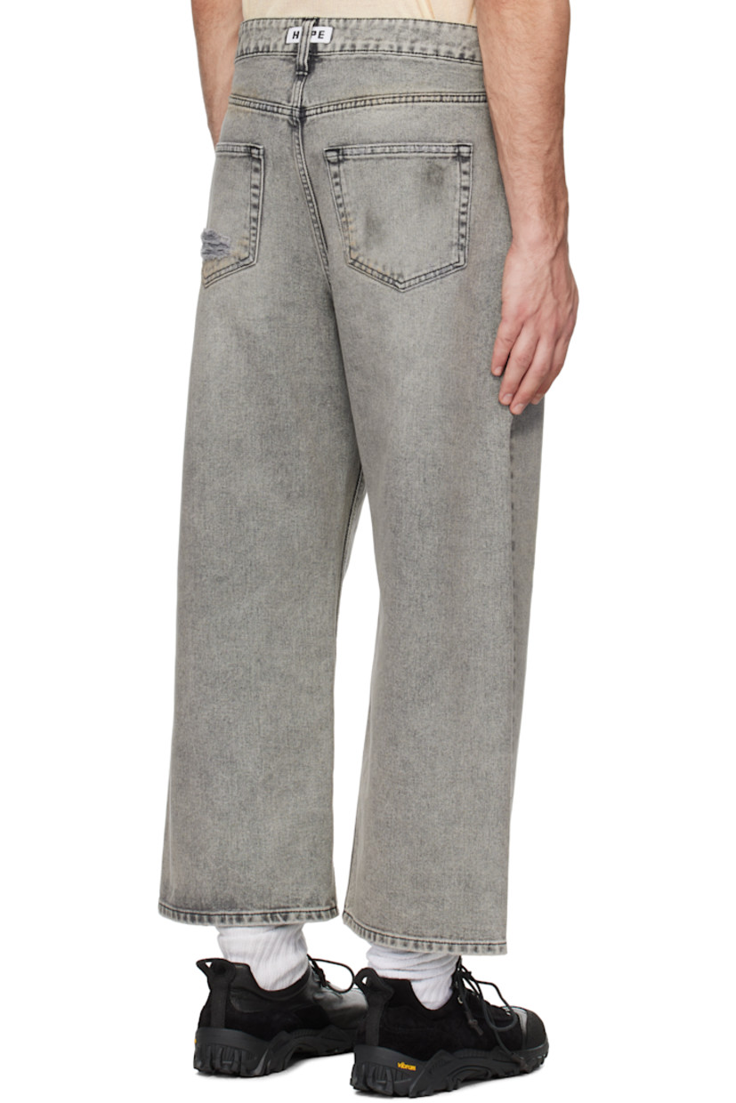 Non-stretch regenerative- and organic cotton-blend denim jeans. Fading and distressing throughout.

· Wide-leg
· Belt loops
· Five-pocket styling
· Button fly
· Dropped inseam
· Cropped legs
· Logo patch at back waistband
· Logo-engraved silver-tone hardware
· Contrast stitching in black

Supplier color: Grey vintage