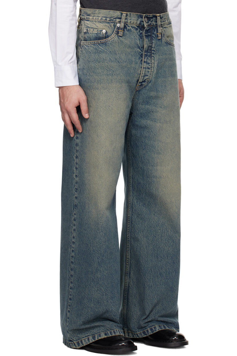 Flared non-stretch regenerative- and organic cotton-blend denim jeans. Fading and whiskering throughout. 

· Wide-leg
· Belt loops 
· Five-pocket styling 
· Button-fly 
· Logo patch at back waistband 
· Logo-engraved silver-tone hardware 
· Contrast stitching in tan 

Supplier color: Mid blue dirty