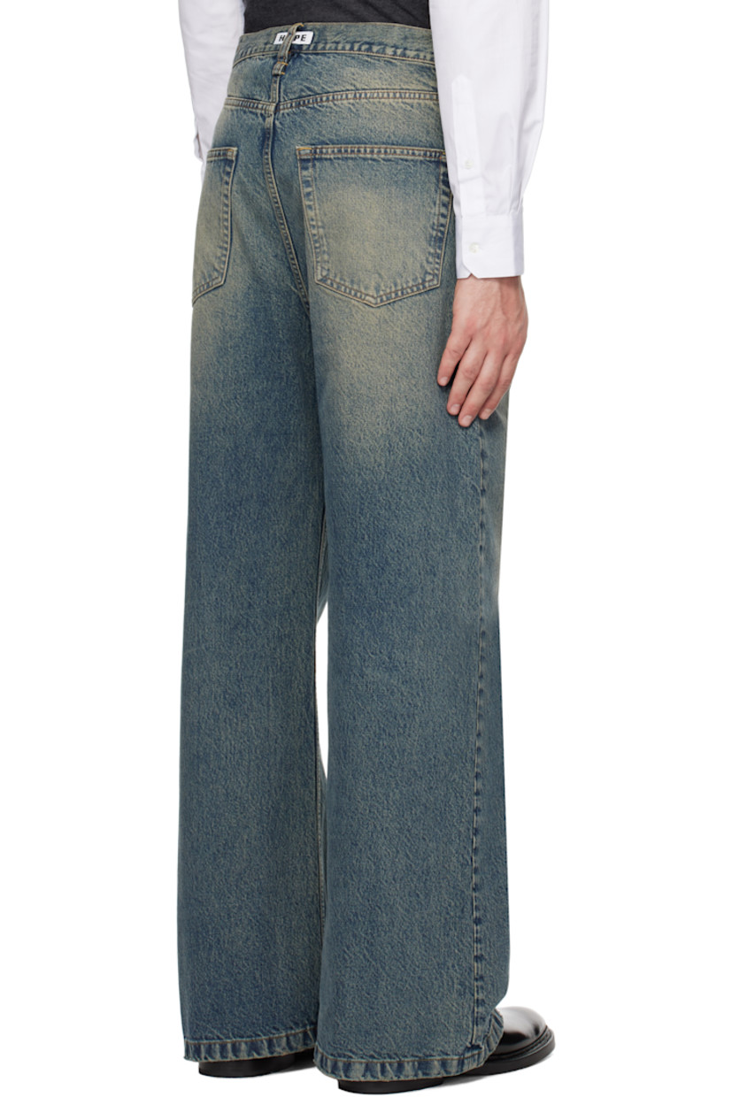 Flared non-stretch regenerative- and organic cotton-blend denim jeans. Fading and whiskering throughout. 

· Wide-leg
· Belt loops 
· Five-pocket styling 
· Button-fly 
· Logo patch at back waistband 
· Logo-engraved silver-tone hardware 
· Contrast stitching in tan 

Supplier color: Mid blue dirty