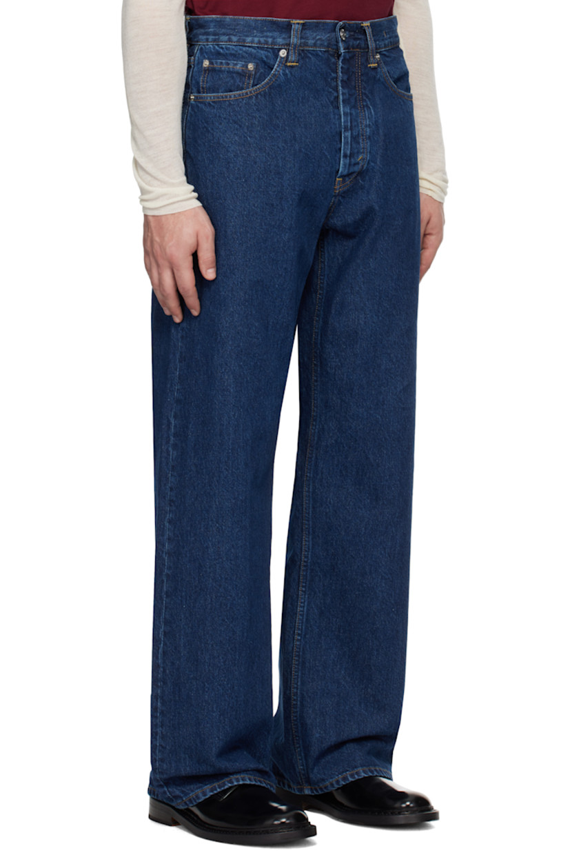 Loose-fit non-stretch regenerative- and organic cotton-blend denim jeans. Fading throughout. 

· Wide-leg
· Belt loops 
· Five-pocket styling 
· Button-fly 
· Logo patch at back waistband 
· Logo-engraved silver-tone hardware 
· Contrast stitching in tan

Supplier color: Indigo wash