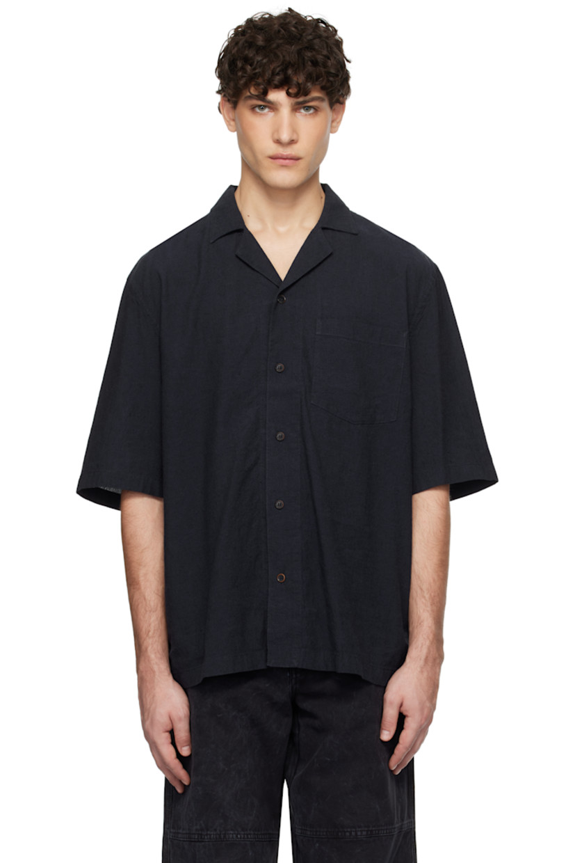 Relaxed-fit plain-woven linen- and cotton-blend shirt. 

· Open spread collar
· Button closure
· Patch pocket
· Box pleat at back yoke
· Corozo hardware

Supplier color: Dark Blue