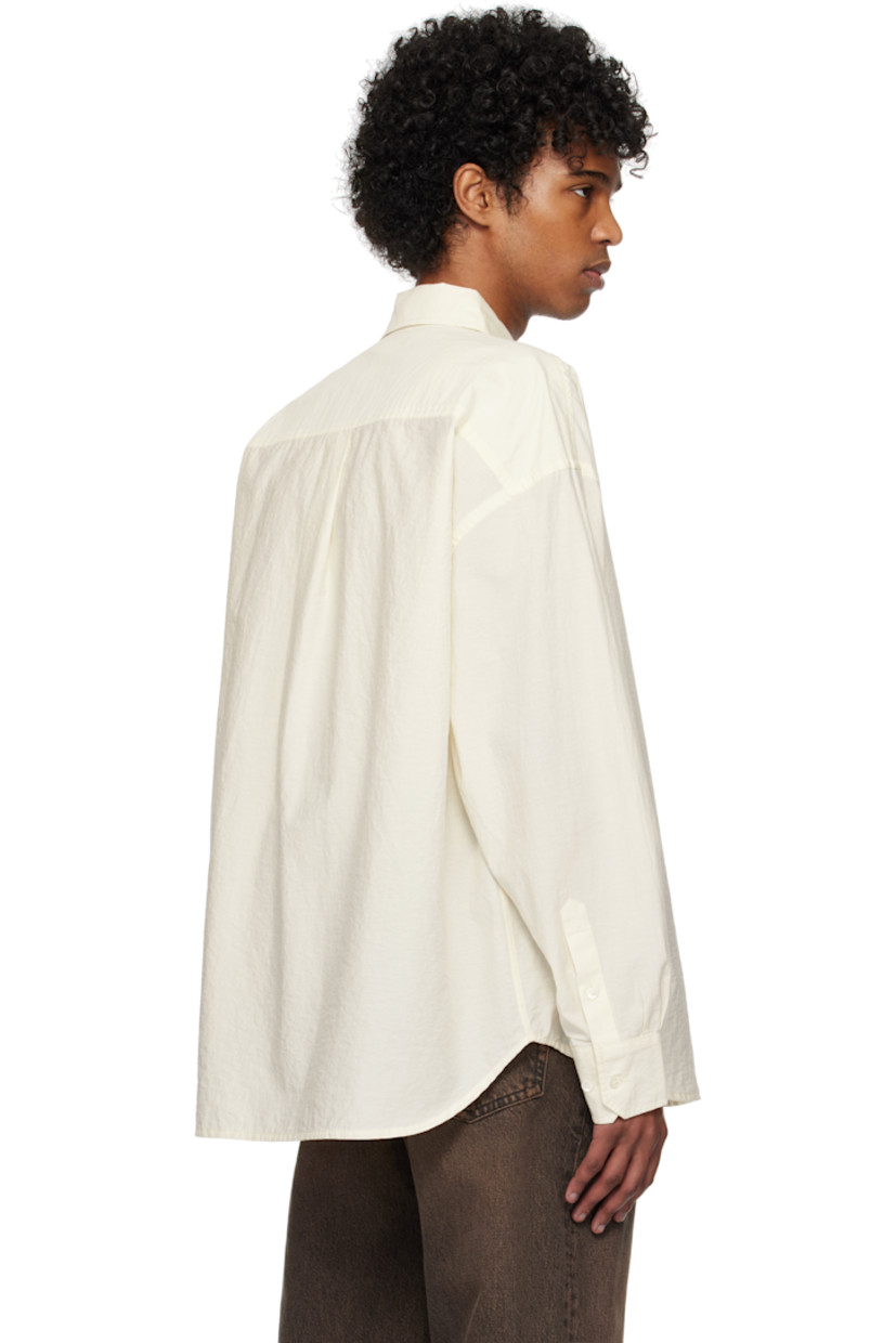 Plain-woven organic cotton- and recycled polyester-blend shirt. 

· GOTS-certified organic cotton
· GRS-certified recycled polyester
· Spread collar
· Button closure
· Patch pocket
· Shirttail hem 
· Dropped shoulders
· Adjustable single-button barrel cuffs
· Box pleat at yoke  
· Mother-of-pearl hardware

Supplier color: Raw white