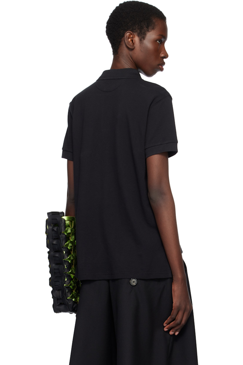 Cotton piqué polo.

· Rib-knit spread collar and cuffs
· Partially concealed two-button placket
· Text and logo graphic printed at front
· Tennis-tail hem
· Metal eyelets at sides

Supplier color: Black