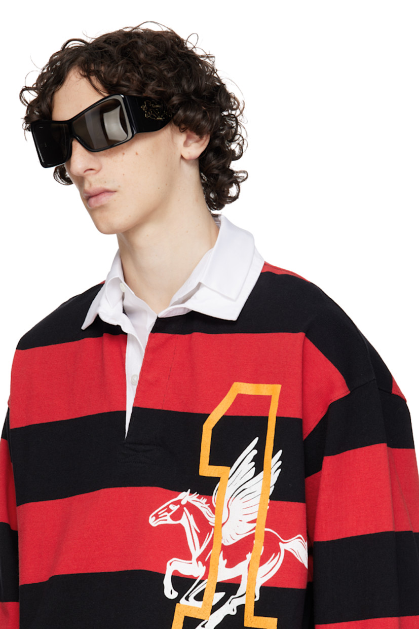 Shield-style acetate-frame sunglasses in black.

· Handcrafted
· Gray lens
· Integrated nose pads
· Inset logo hardware at temples
· Gold-tone hardware
· Includes case 
· Size: 137. 142 

Supplier color: Black